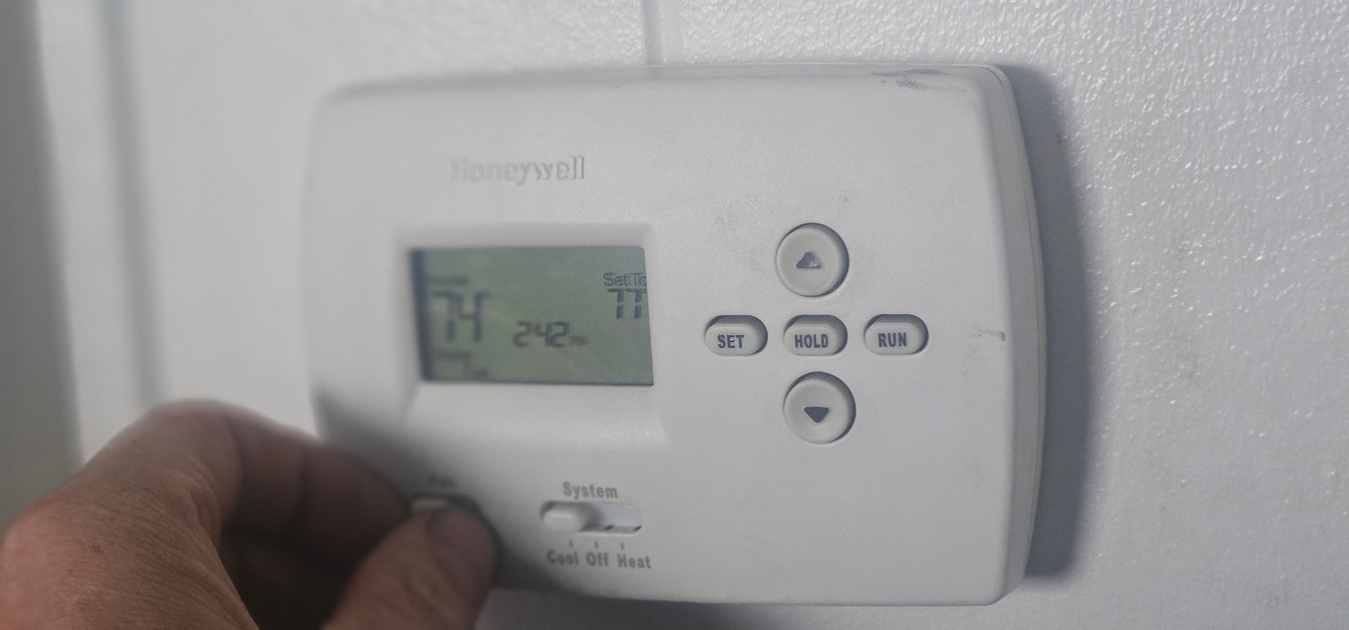 A clean furnace filter being installed.